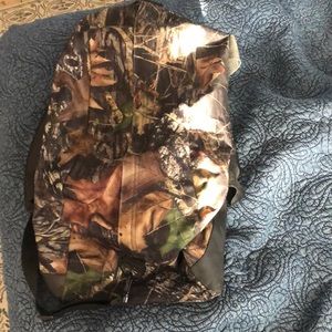 Camo duffle bag side pocket, and external shoe compartment.